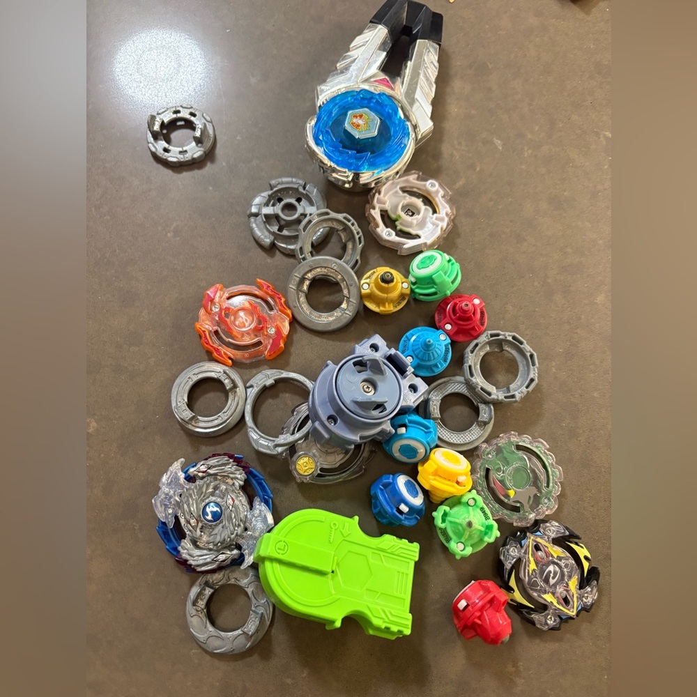 Vintage lot of Beyblades launcher, metal and assorted pieces